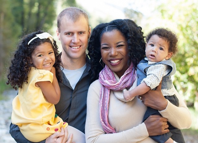 Image courtesy Jennifer Borget via Flickr. Image of an interracial family consisting of a White man, a Black woman, and a pre-school aged daughter and a baby